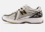 Zapatillas New Balance 1906R metallic silver/gold