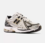 Zapatillas New Balance 1906R metallic silver/gold